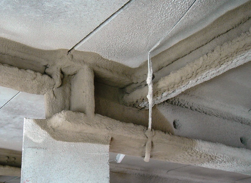 Beams protected with spray plaster (source: Wikipedia). Beams protected with spray plaster.